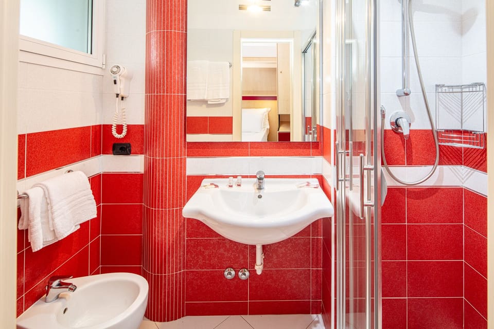Shower, free toiletries, hair dryer, slippers