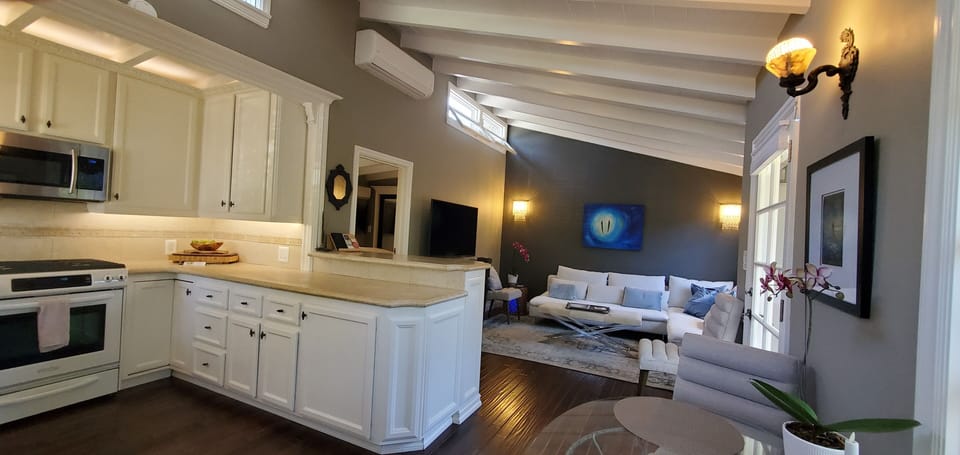 WIDE ANGLE OF KITCHEN / OPEN LIVING AREA