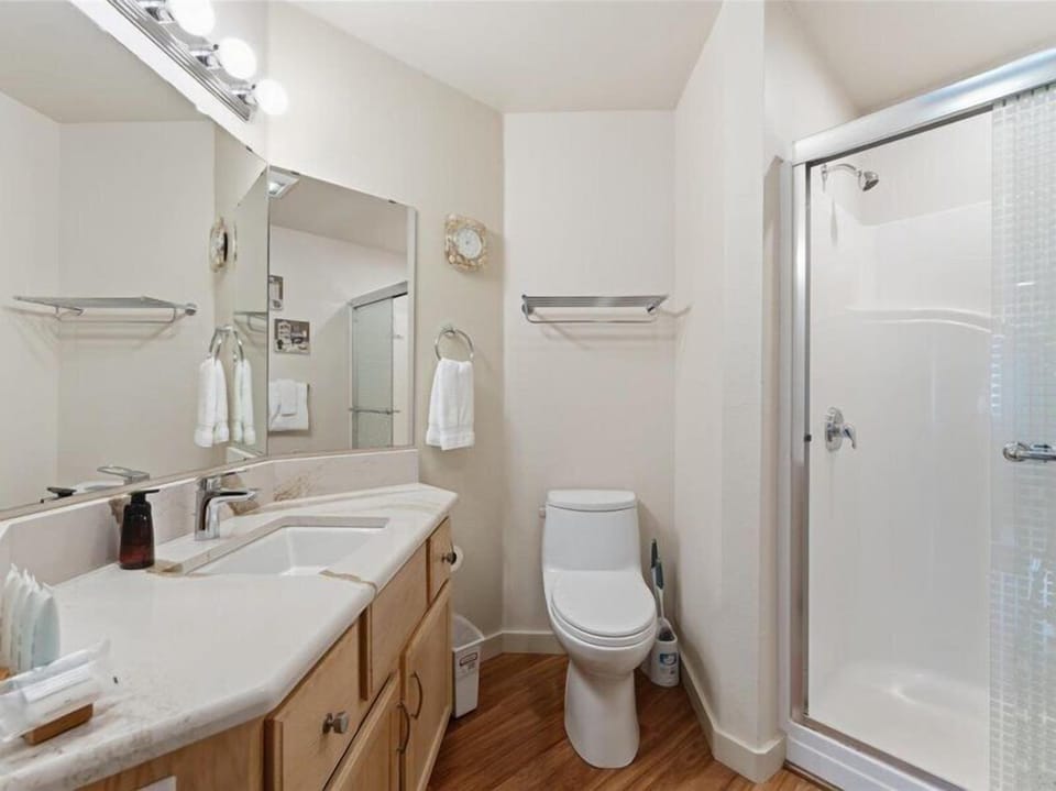 Your private bathroom features a spacious vanity, rainfall shower, and all the essentials you need to feel refreshed and at home during your stay.