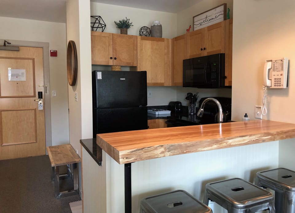 Kitchen featuring bar seating