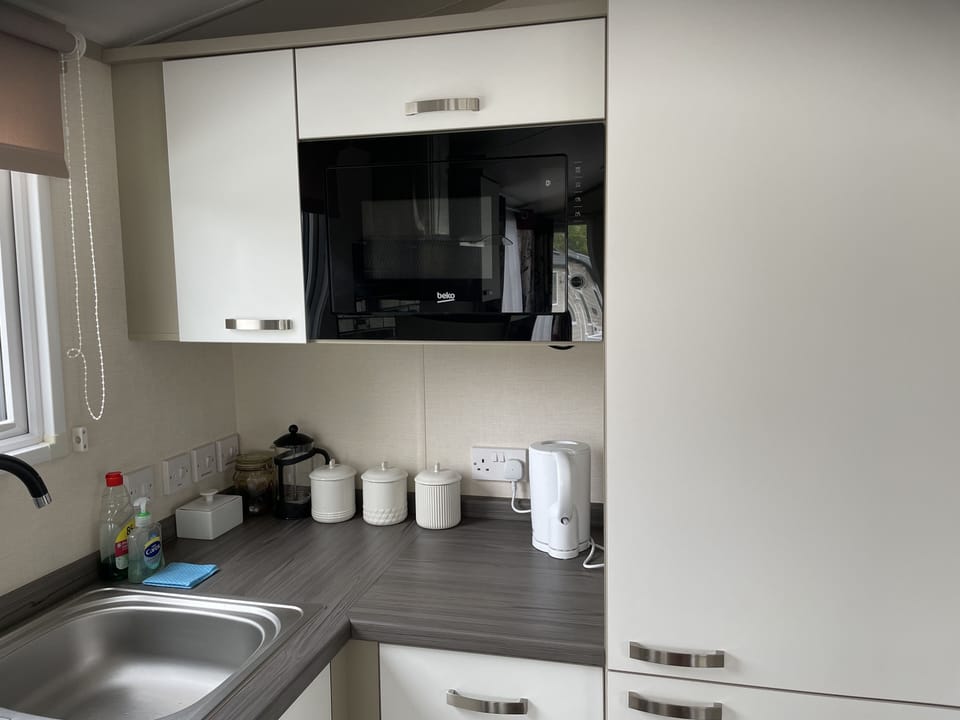 Canisters and kettle in kitchen area