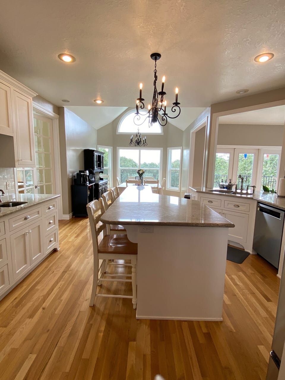 Beautiful clean and bright kitchen with views. Table & island  that seats 11