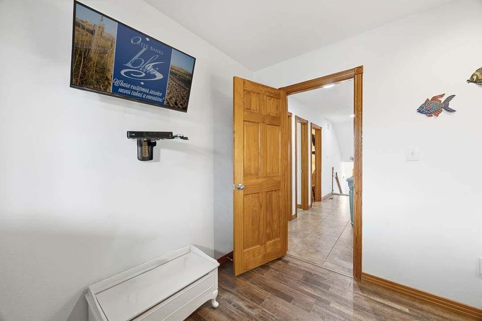 Mid-Level Den with Queen Sleeper Sofa and Deck Access