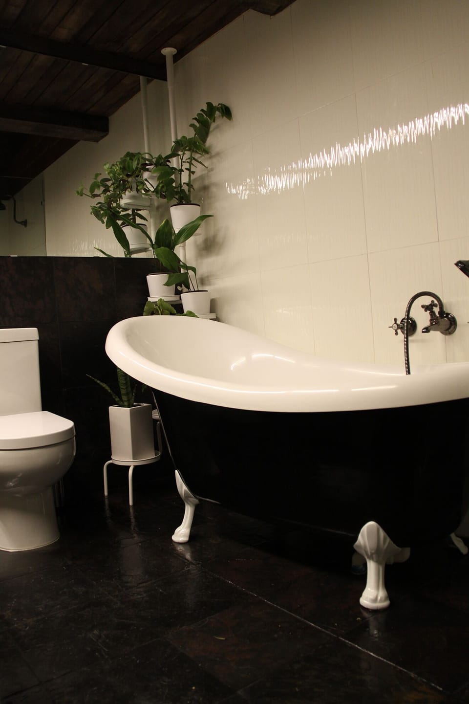 Clawfoot bathroom with seperate shower, entrance from shared living areas