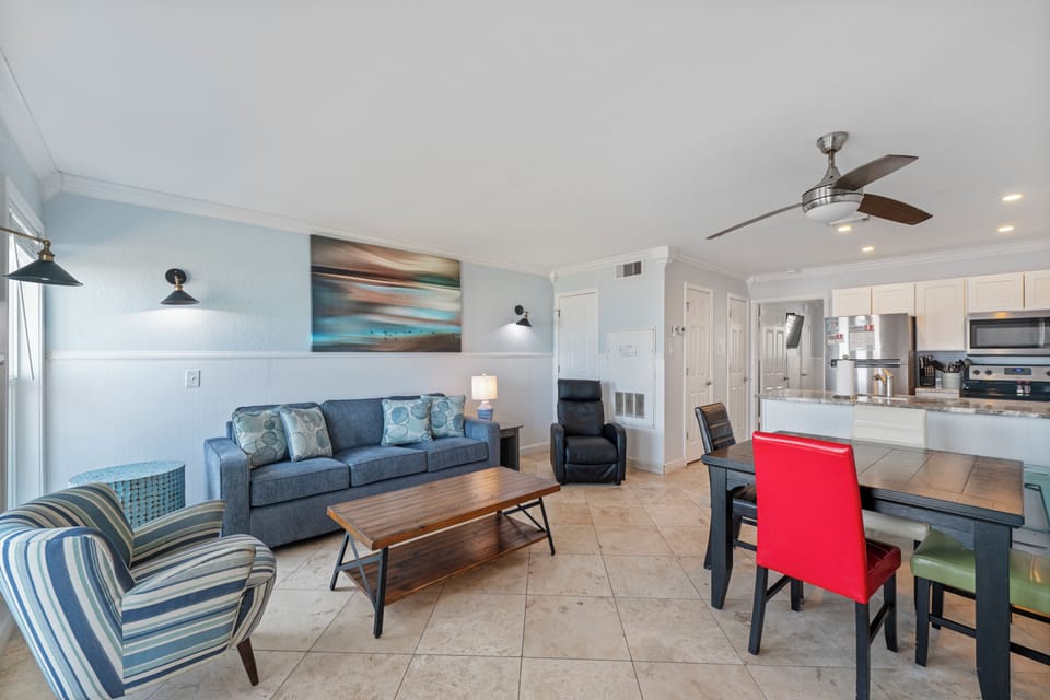 Relax in your bright, modern living space with comfortable seating and a fully equipped kitchen for all your coastal getaway needs.