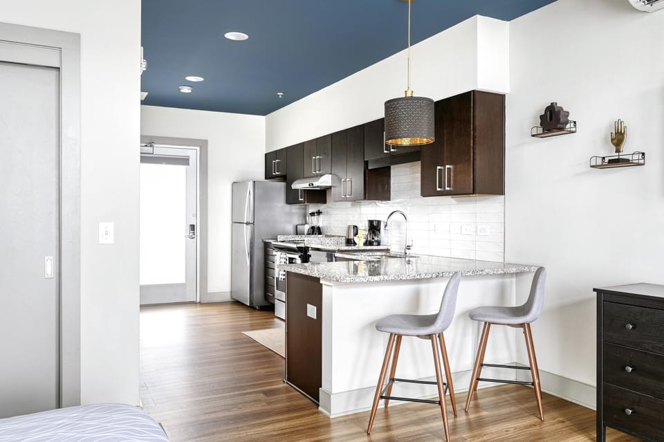 Modern kitchen with sleek cabinetry and cozy breakfast bar seating