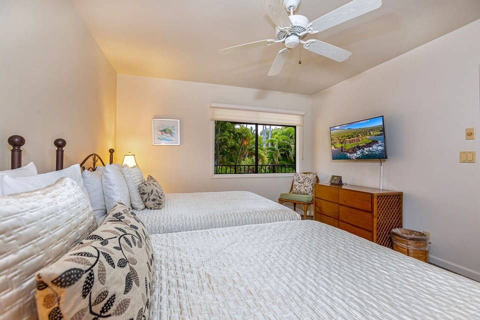 Enjoy a movie and the tropical view from the guest bedroom