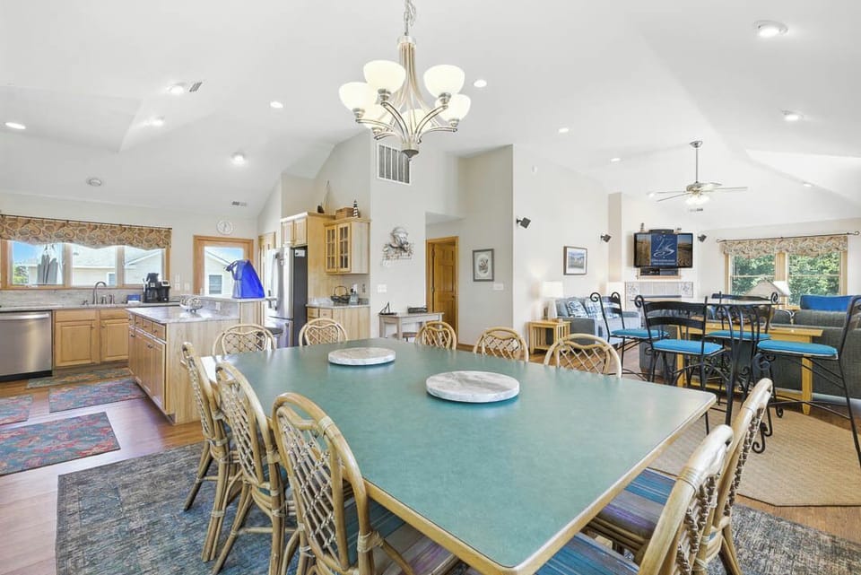 Top-Level Dining Room with Table (seats 12) and Additional Table (seats 4)