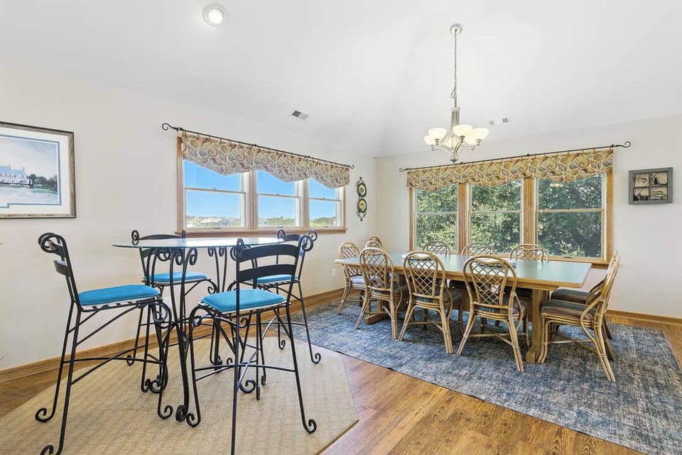 Top-Level Dining Room with Table (seats 12) and Additional Table (seats 4)