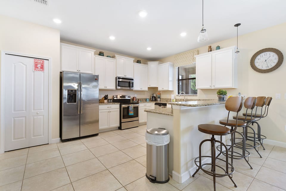 Cook gourmet meals in the the fully equipped kitchen with stainless steel appliances