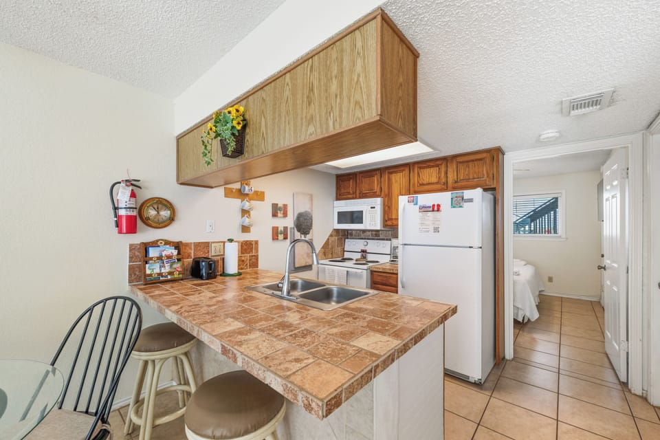 Pull up a seat at the breakfast bar for morning coffee, quick bites, or conversation while meals are being prepared.