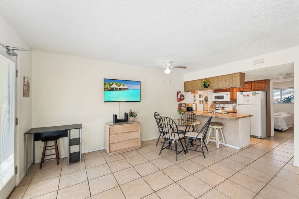 Gather around the dining table for meals, games, and quality time in this bright, open-concept space.