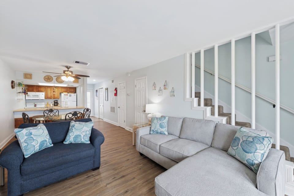 Step into your bright, welcoming retreat with comfortable seating perfect for gathering with loved ones. The open-concept layout connects living, dining, and kitchen spaces for effortless entertaining and relaxation.