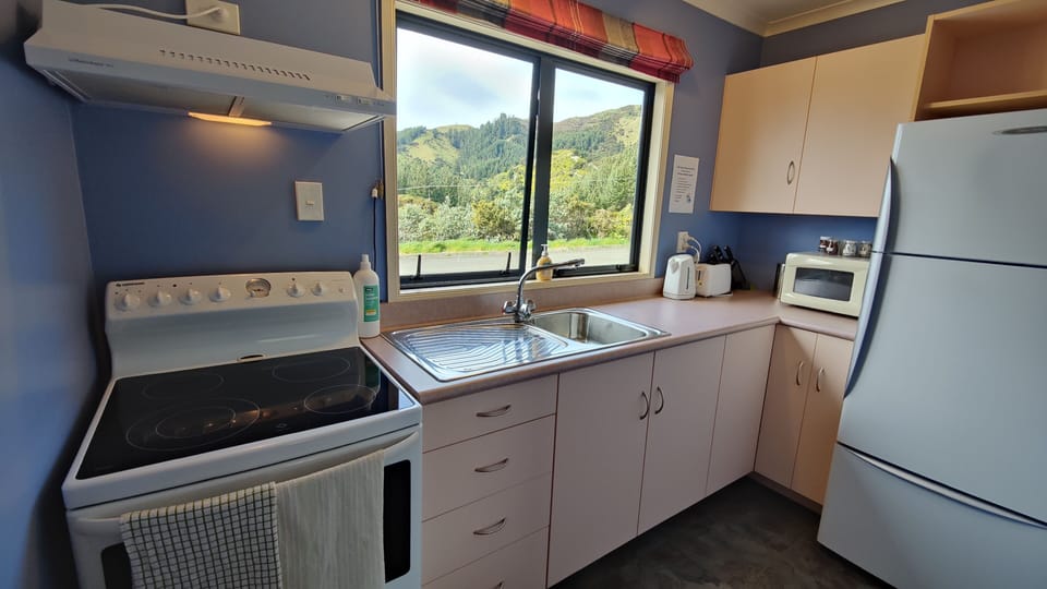 Studio kitchen is fully equipped, with stove oven and large fridge freezer