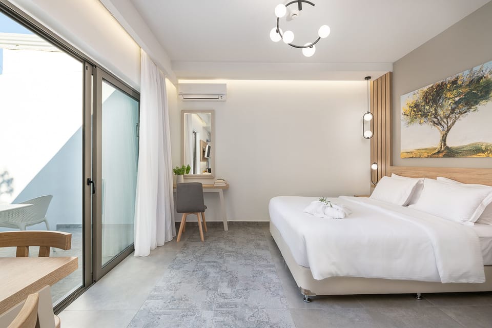 Apartment, Pool View | Minibar, in-room safe, desk, laptop workspace