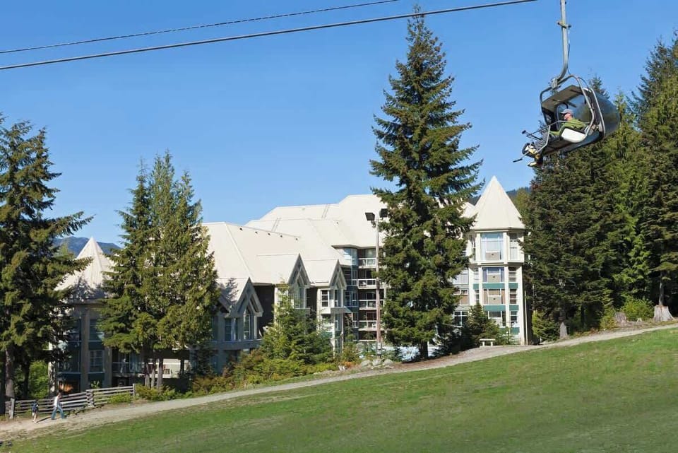 - True ski-in ski-out Whistler lodge beside scenic chairlift mountain base  
- Enjoy year-round adventure from your doorstep surrounded by forest  
- Ideal mountain retreat offering comfort access and natural beauty  