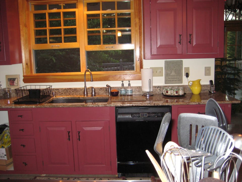 Kitchen sink area looking onto back porch.