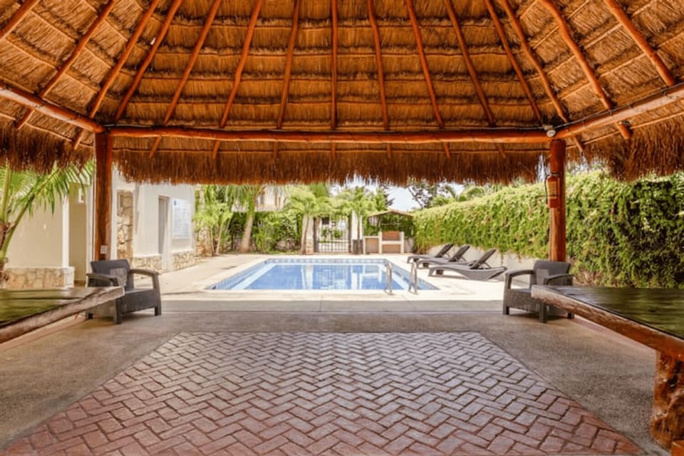 a beautiful pool whit palapa for your enjoyment