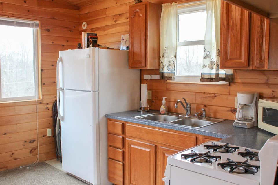 You will find pots & pans, coffee maker, microwave, and select seasonings. 