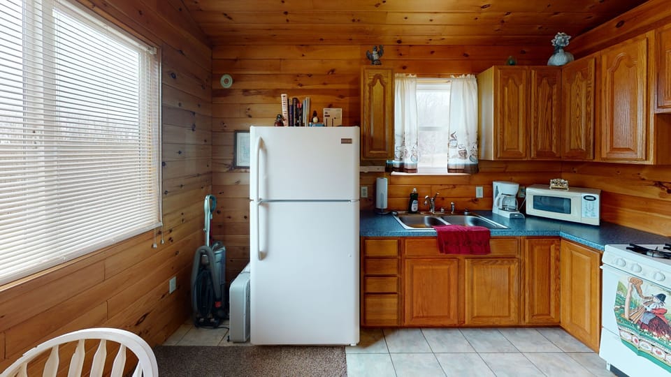 Kitchen comes equipped with  refrigerator, stove & oven, utensils, and dishes.