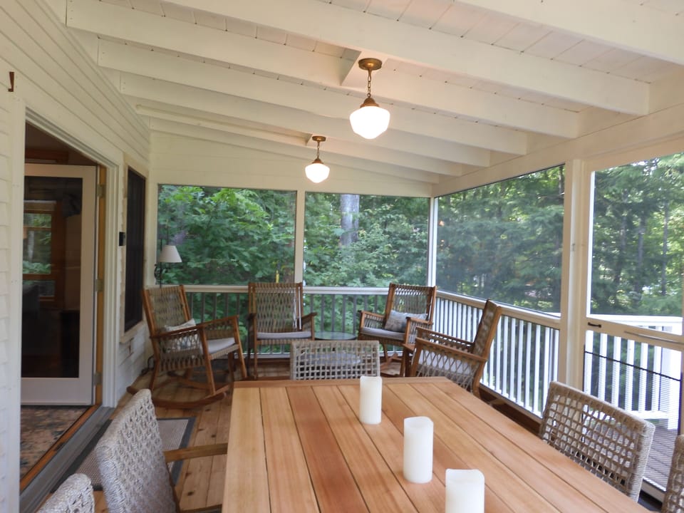 Dining table seats six and has a lovely view of lake, garden and yard. 
