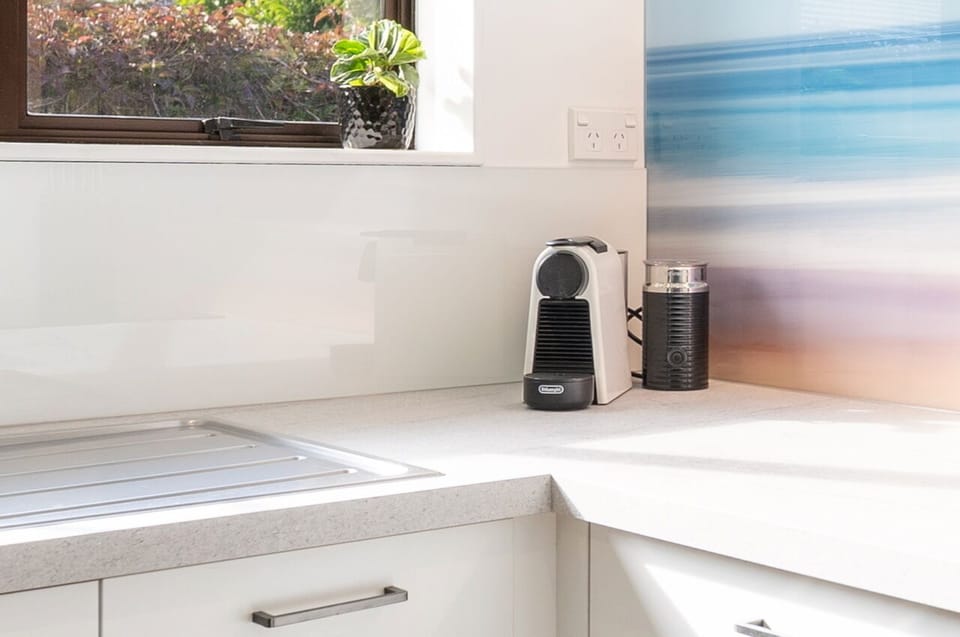 Appliances include large fridge freezer, microwave, Nespresso machine & frother