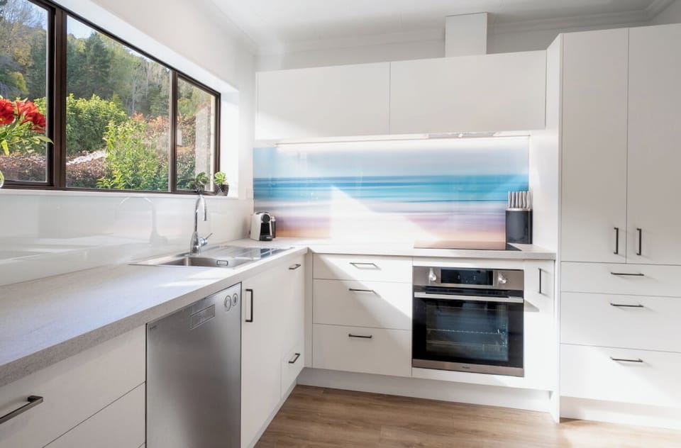 Fully equipped kitchen including oven, hob and dishwasher