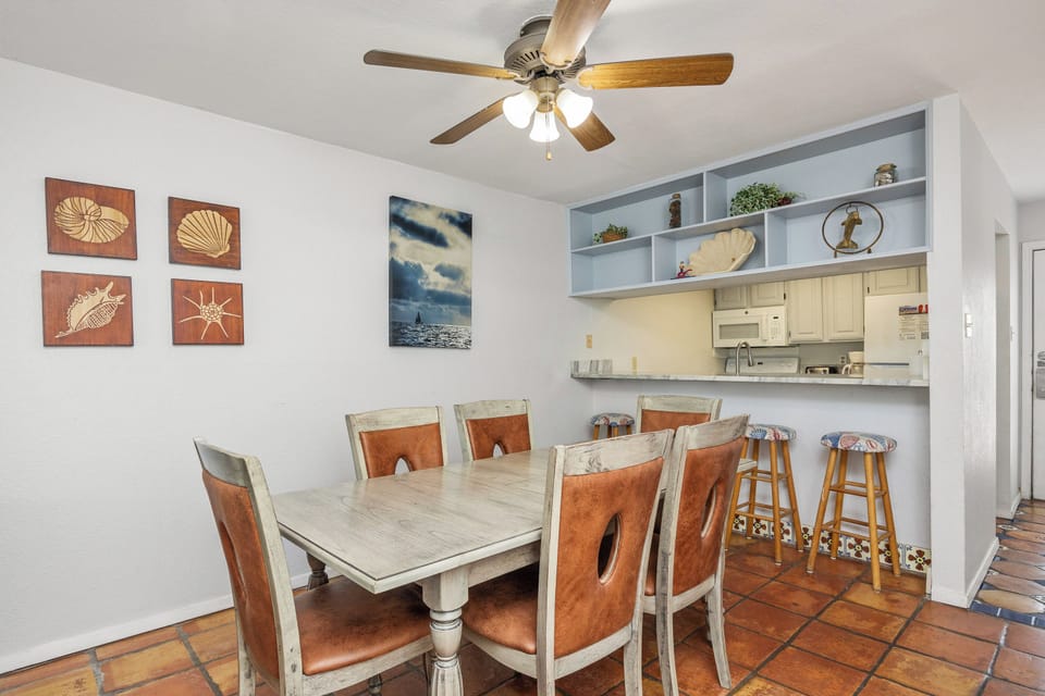 Gather around this spacious dining table with comfortable seating for eight, where your group can enjoy meals together.