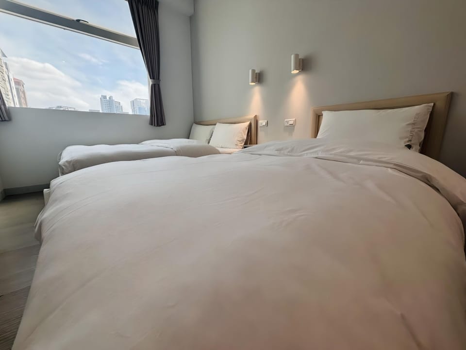 Triple Room with Shared Bathroom | Down comforters, desk, blackout drapes, free WiFi