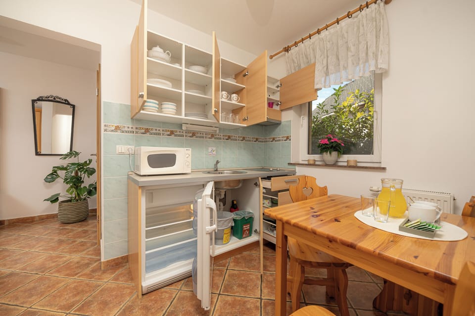 Comfort Studio Suite, 1 Bedroom, Non Smoking, Balcony | Private kitchen | Mini-fridge, electric kettle, highchair