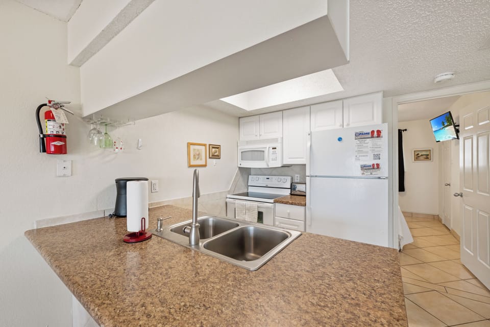 Your fully-equipped kitchen features granite countertops, stainless steel appliances, and everything you need to create memorable vacation meals together.