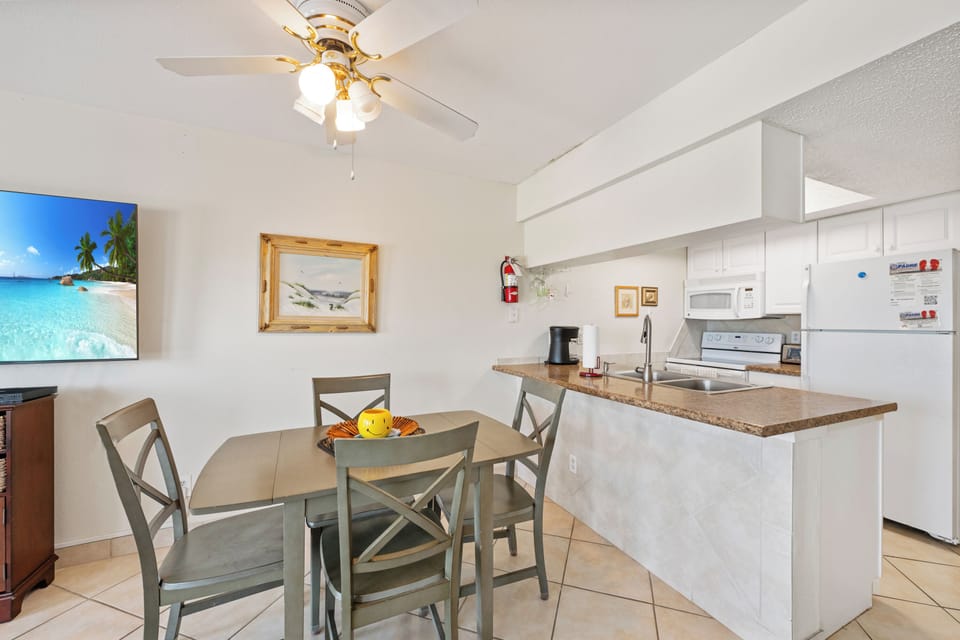 Your bright, open-concept kitchen and dining area features modern appliances and cozy seating for memorable meals together.