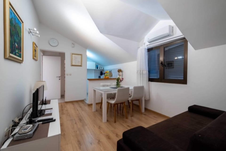Apartment, 1 Bedroom, Patio, Sea View | Living area | Flat-screen TV