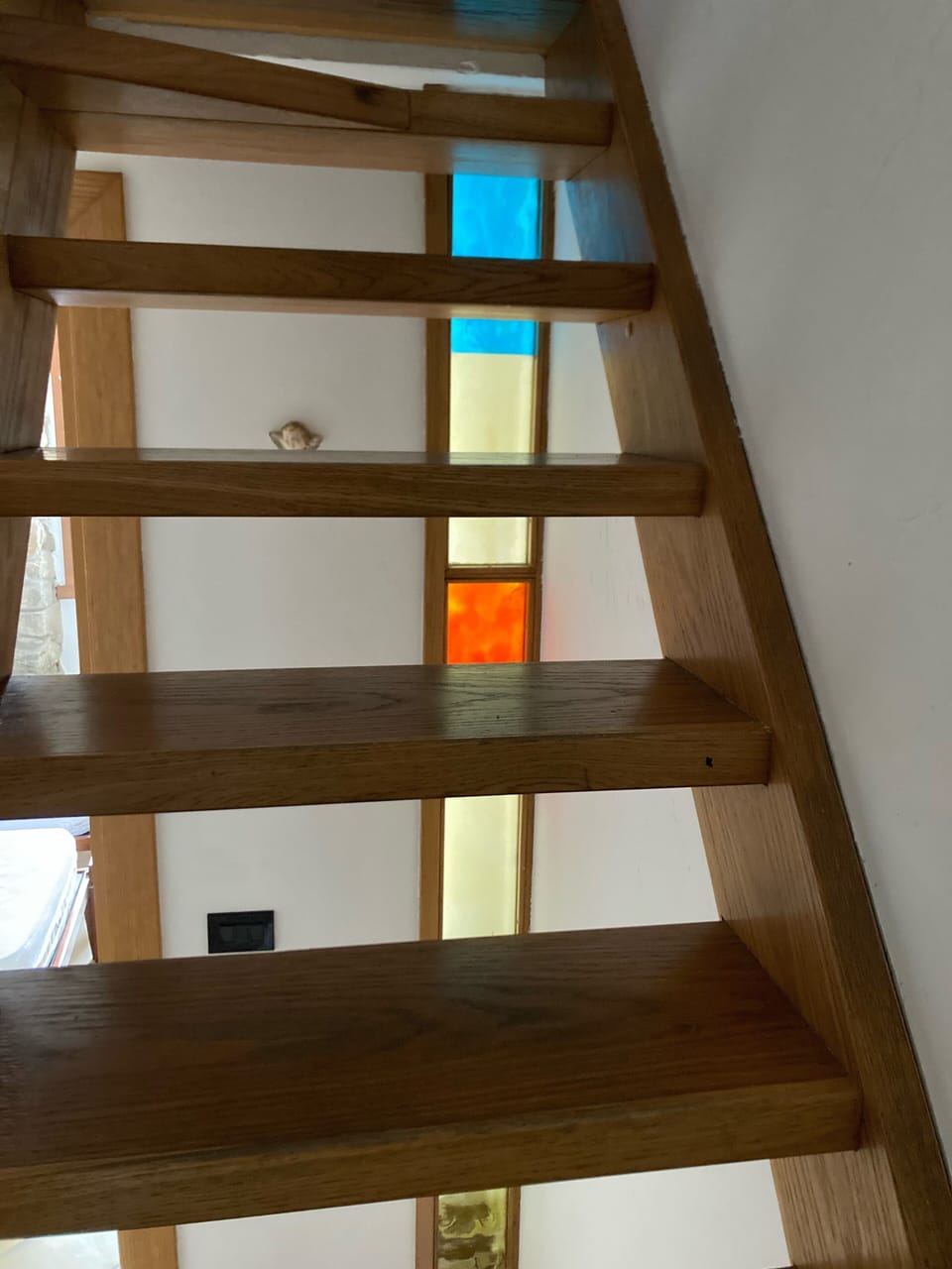 Staircases on Floors 1 and 2 both have feature glass panels.