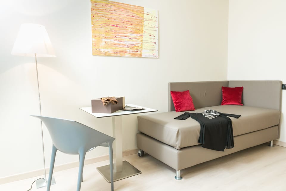 Junior Suite, 2 Bedrooms | Down comforters, minibar, in-room safe, individually furnished