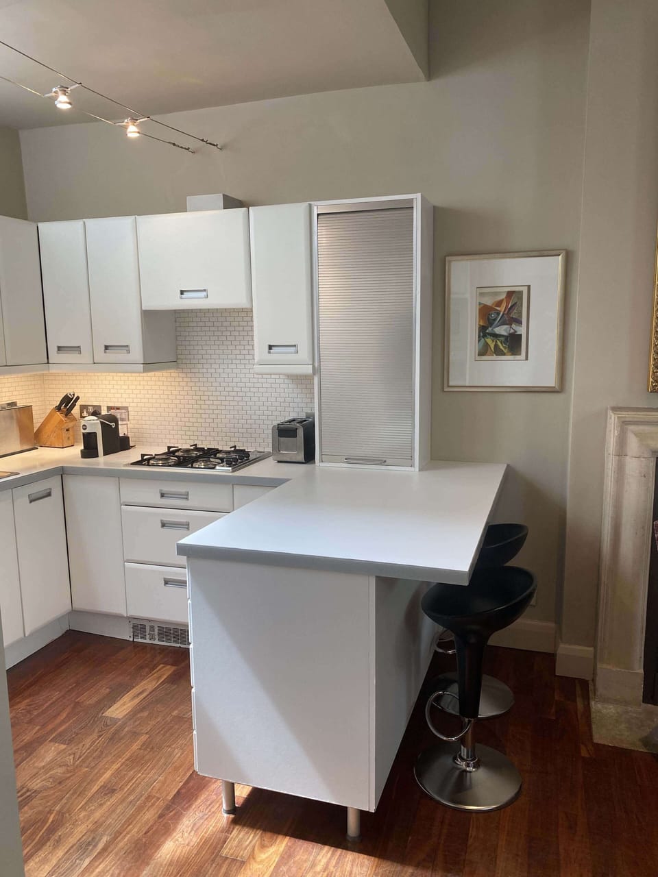 The kitchen with breakfast bar