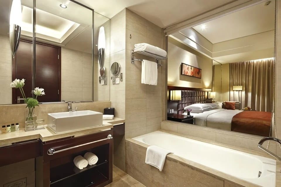 Family Twin Room, City View | Bathroom | Combined shower/tub, rainfall showerhead, eco-friendly toiletries