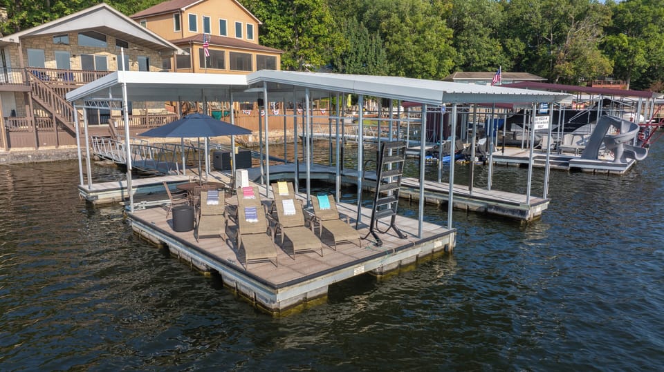 Private dock w/ 12'x30' boat slip, PWC lift, 6 loungers and table w/ 4 chairs.