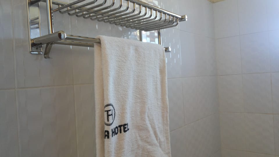 Shower, rainfall showerhead, towels, soap