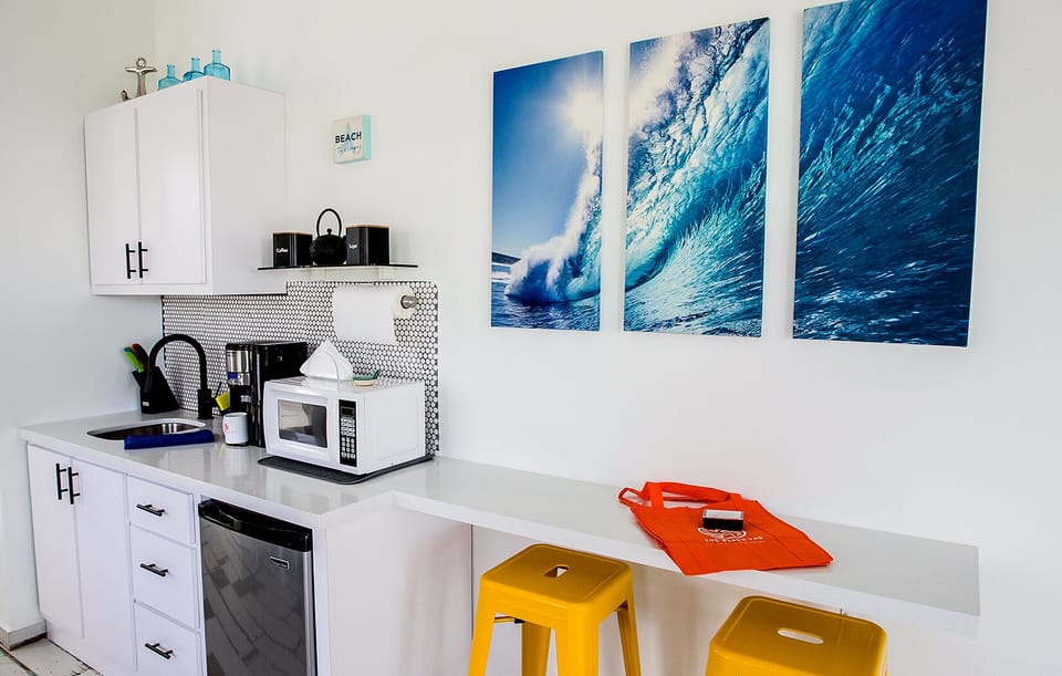 Kitchenette with appliances and seating area