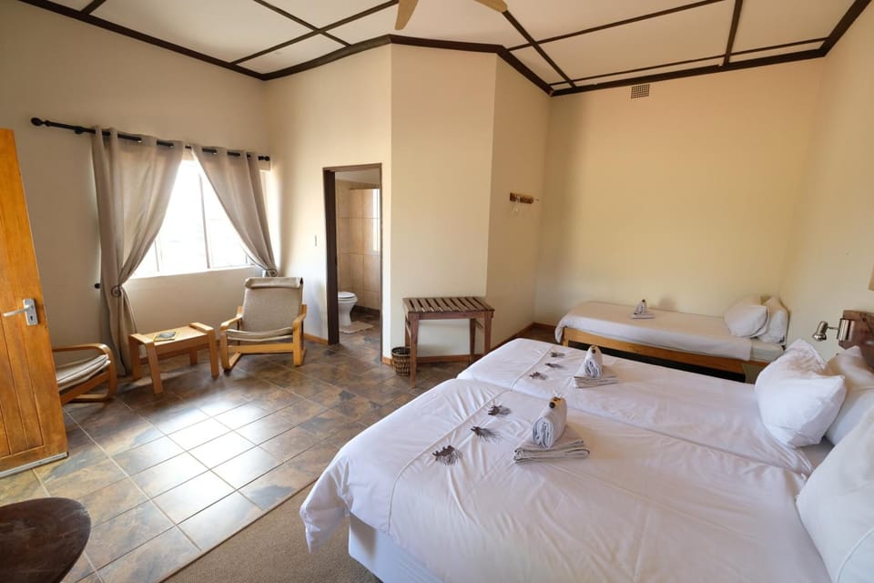 Triple Room | Iron/ironing board (on request), bed sheets