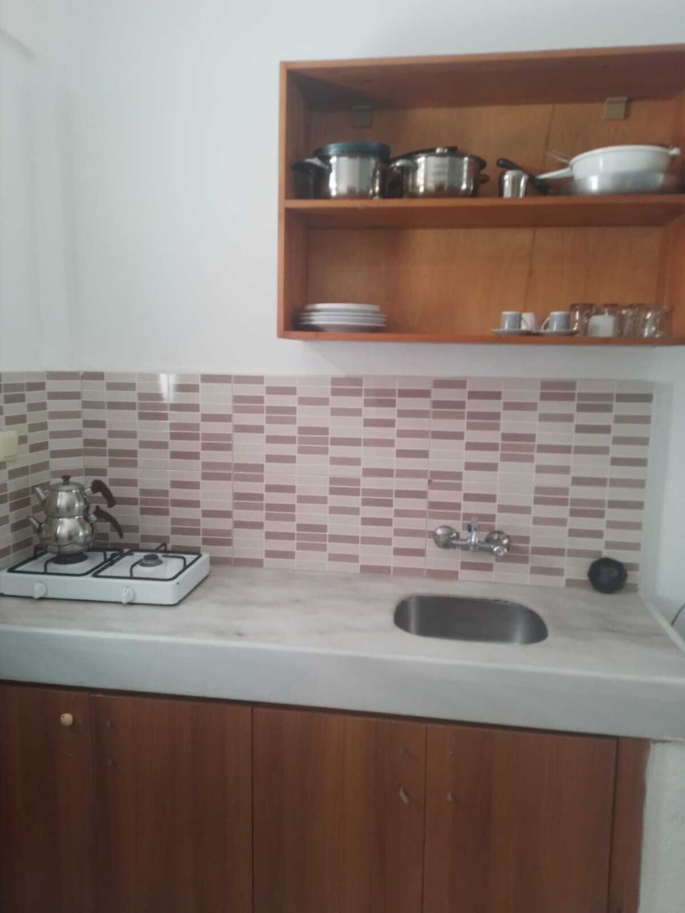 Fridge, stovetop, cookware/dishes/utensils, dining table