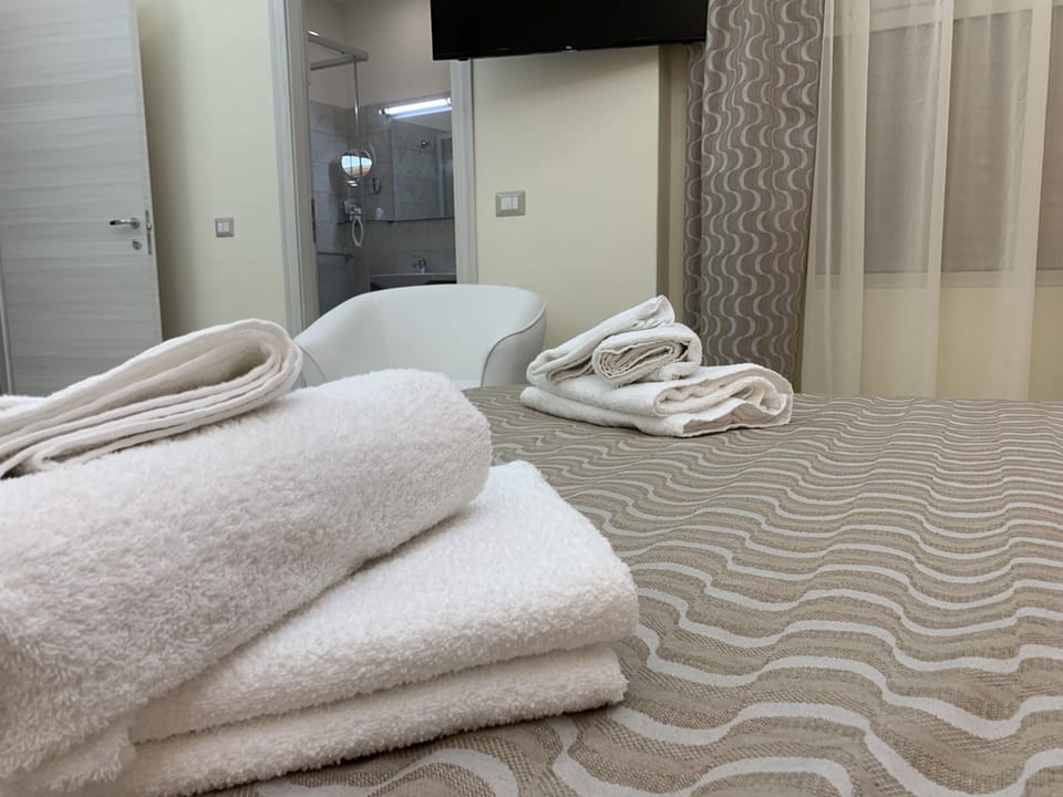 Deluxe Quadruple Room | Premium bedding, down comforters, minibar, individually furnished
