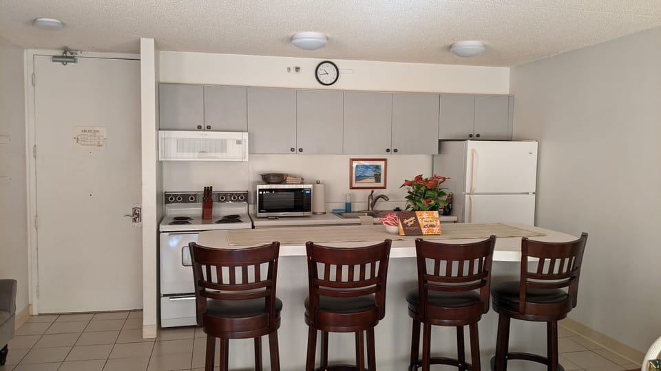 kitchen counter with bar stools
