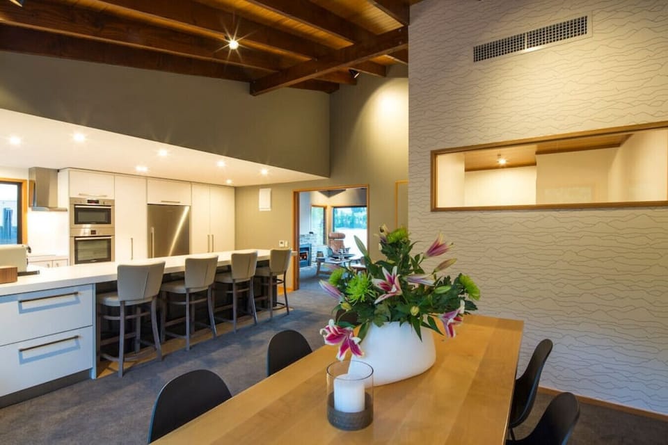 Open plan kitchen and dining space with access to the back patio