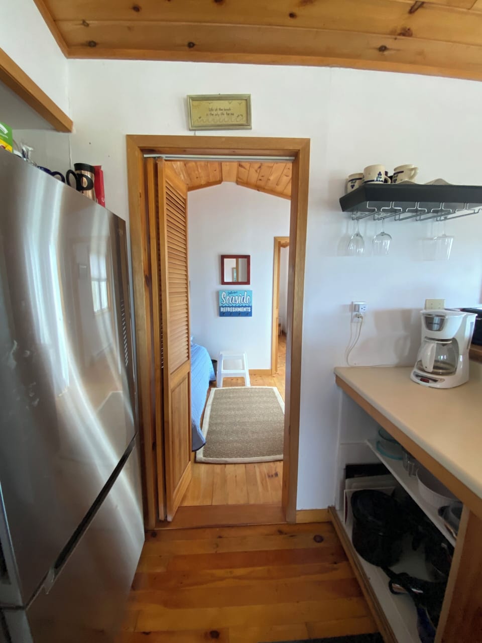 View of the path through the kitchen to the master bedroom.