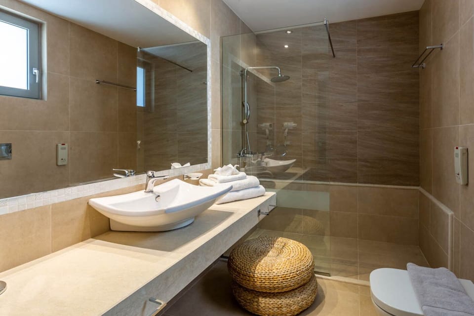 Shower, free toiletries, hair dryer, slippers