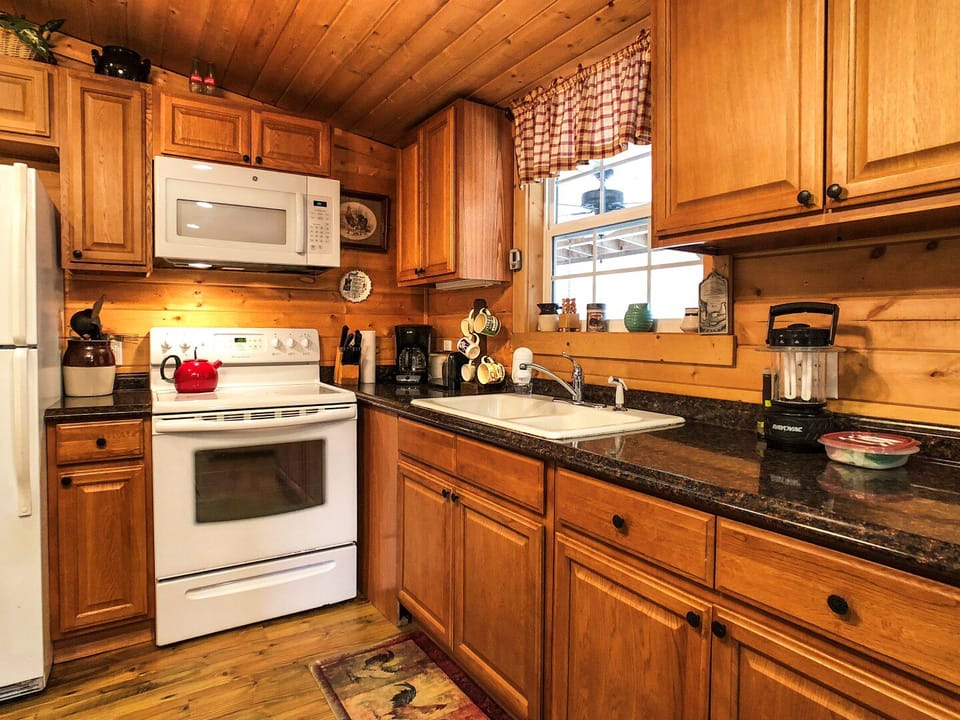 Keurig and Mr. coffee, crockpot, pots and pans and a well stocked kitchen.