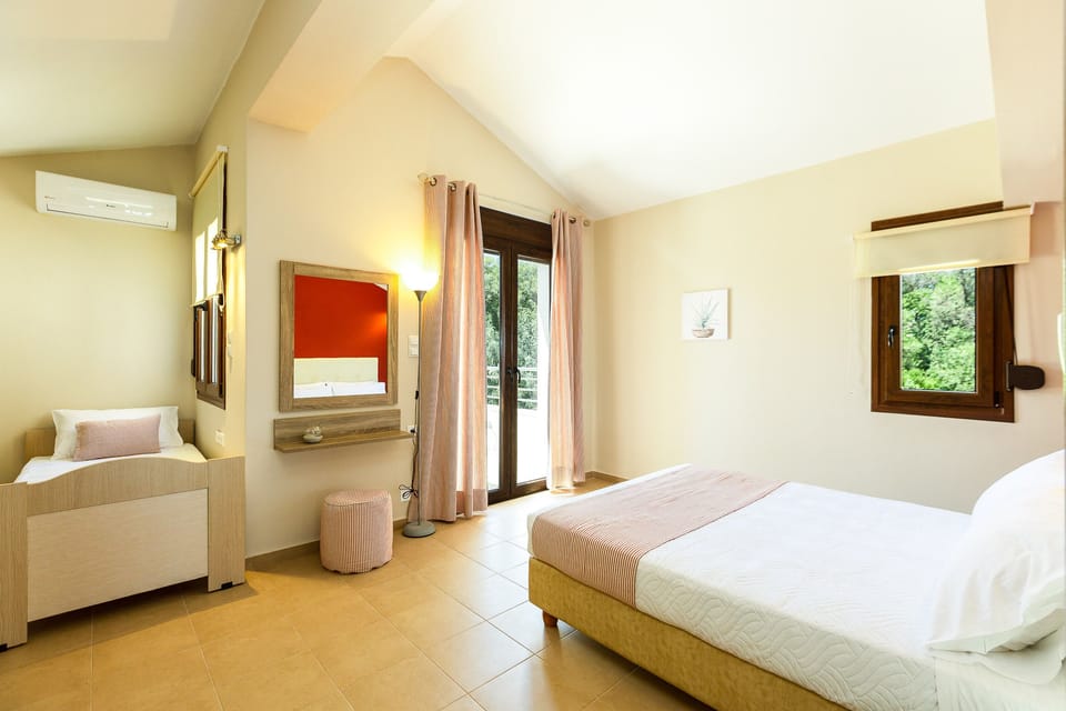 The bedroom feature one double and one single bed and direct access to a balcony