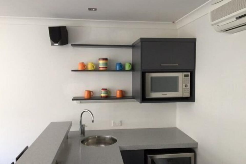 Kitchenette with microwave, toaster, Nespresso, dishwasher, large fridge freezer